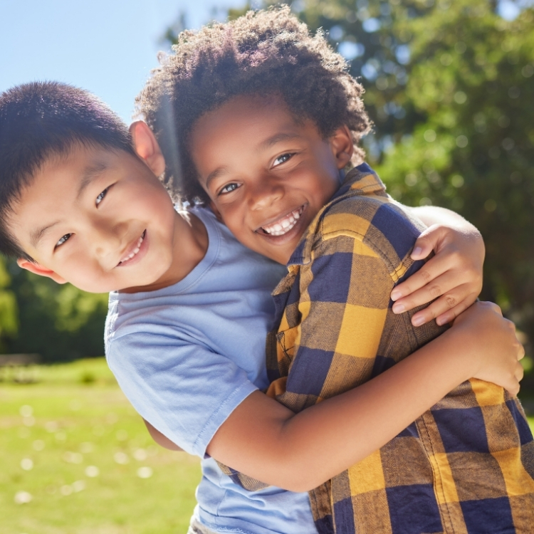 Feb-blog-2 young kids hugging and smiling
