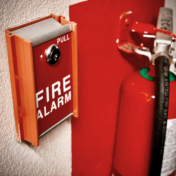 October-blog-1 Image depicting a fire alarm and fire extinguisher